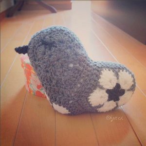 A gray bird made by chitchwork